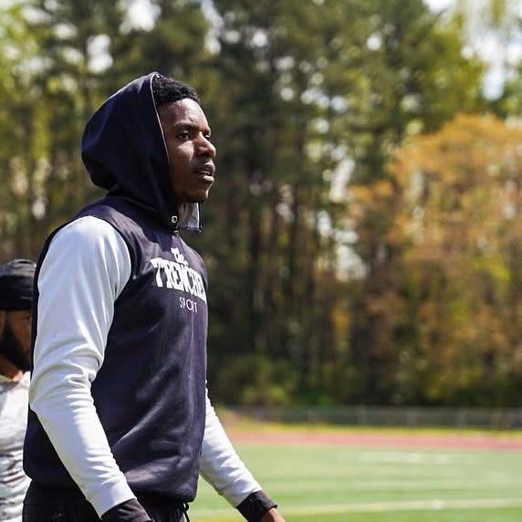 Marquez Spencer observing a football training session
